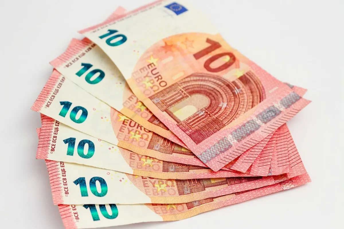 Euro banknotes fanned out on a table